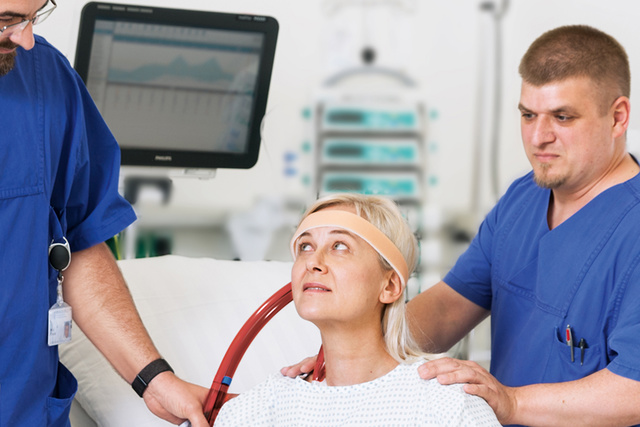 ECMO patient with clinicians in ICU