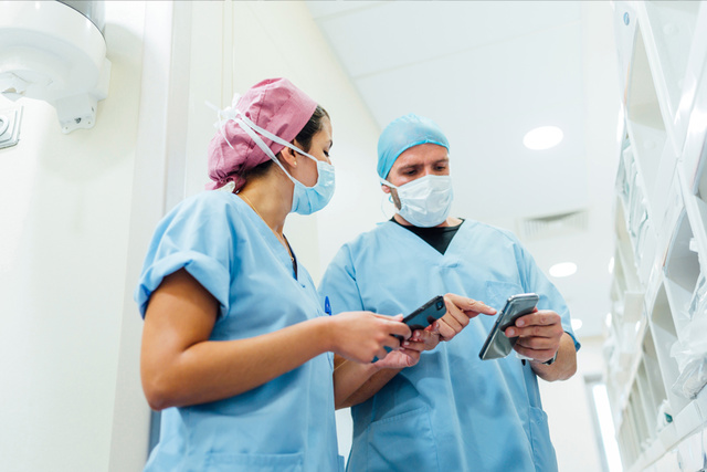 Talis and 2 Clinicians looking on Screens