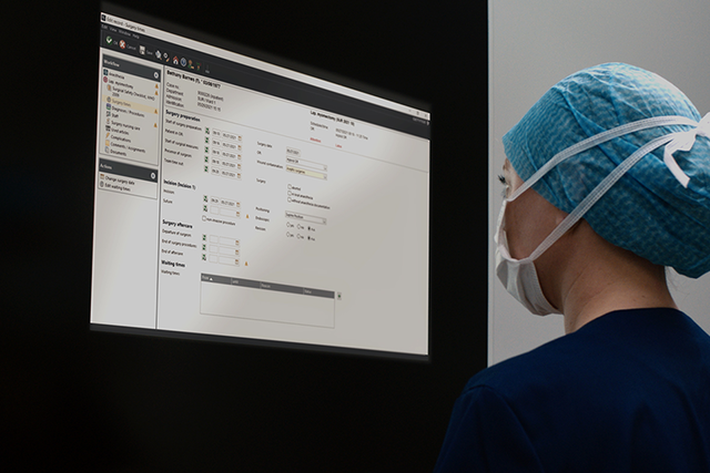 Nusre in front of monitor is using Torin OR Management system