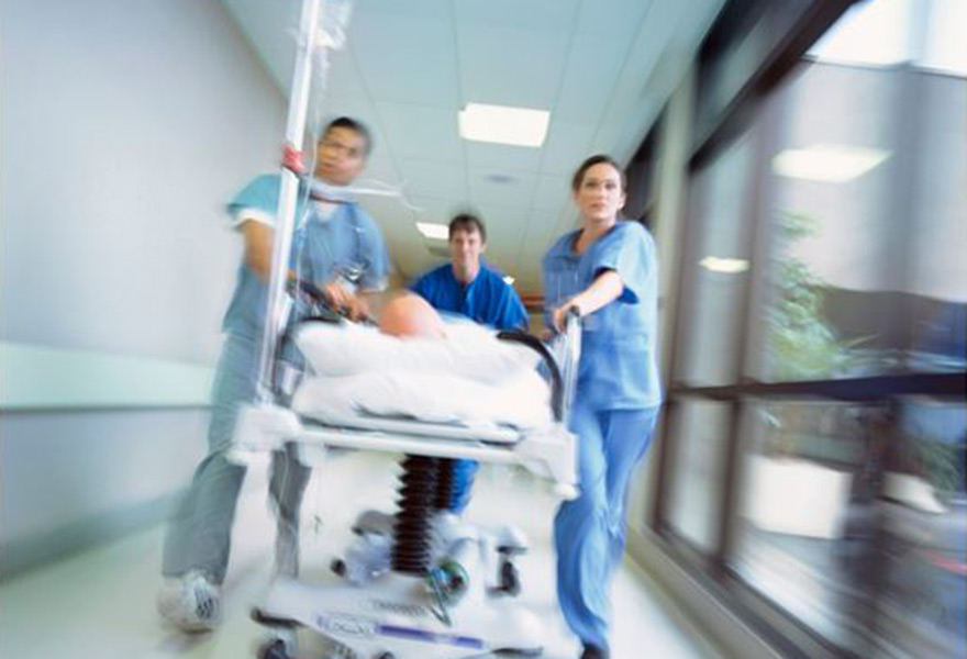 Nurses rushing patient to cath lab