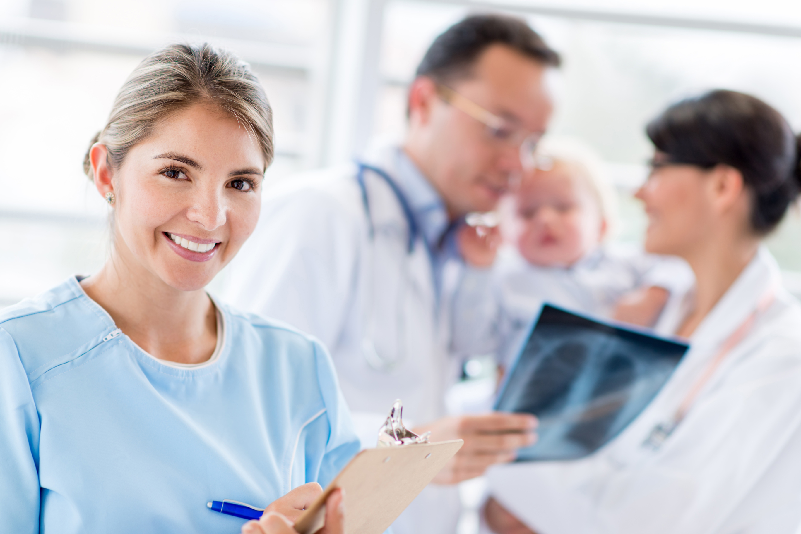 Doctor and nurses smiling