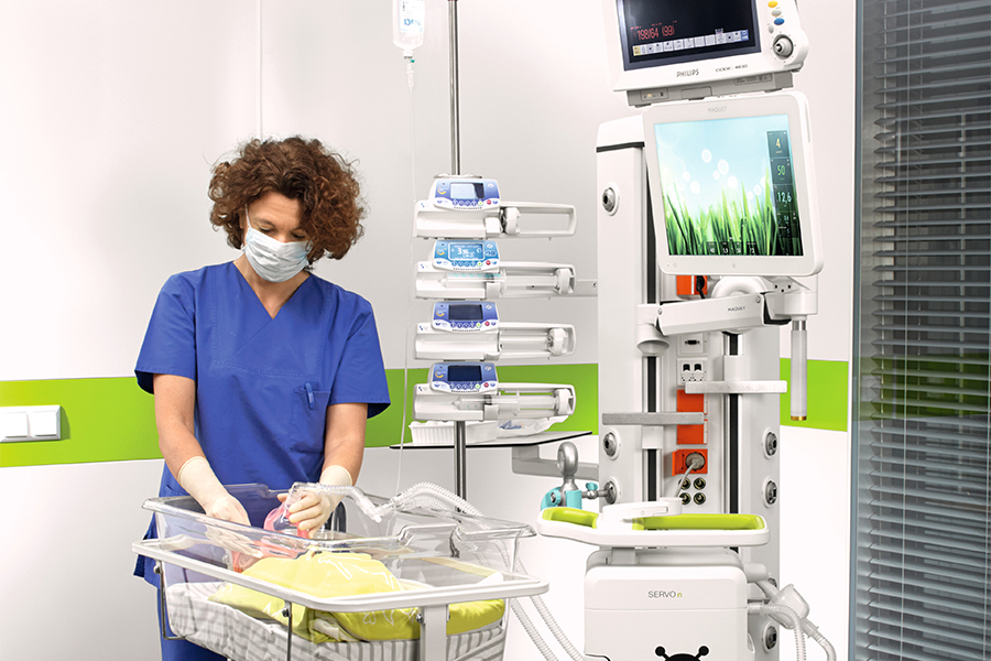 Nurse with newborn patient, ICU recovery Nurse with newborn patient, ICU recovery