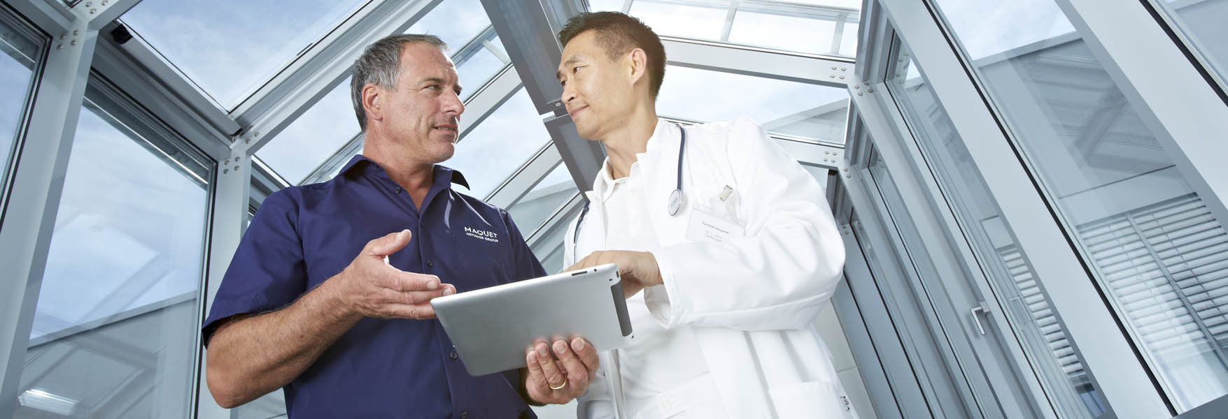 Doctor with a man holding ipad