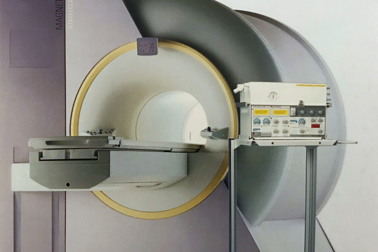Servo 900 mechanical ventilator on mobile cart positioned next to Magnetic resonance imaging MRI machine in MR-suite 