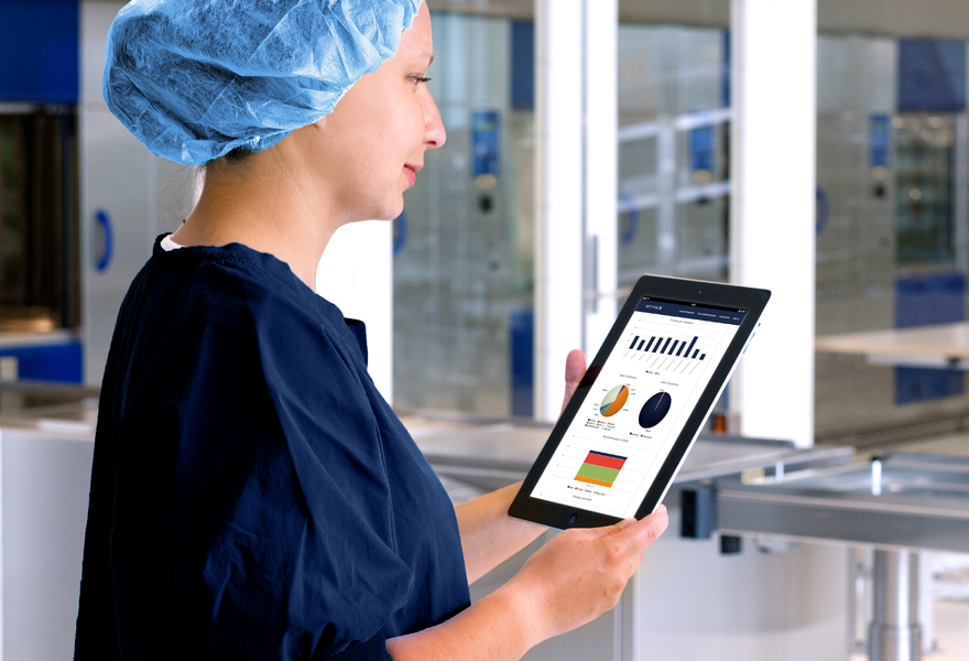 Female doctor looking at a tablet screen with graphics